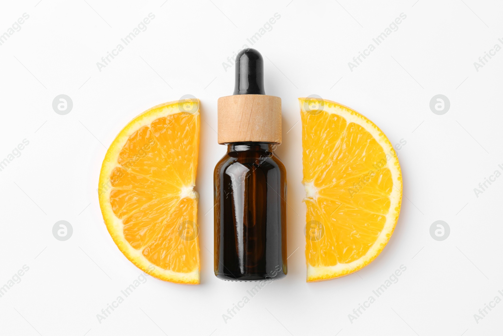 Photo of Bottle of essential oil and orange on white background, flat lay