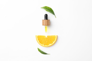 Photo of Dropper of essential oil, orange and green leaves on white background, flat lay