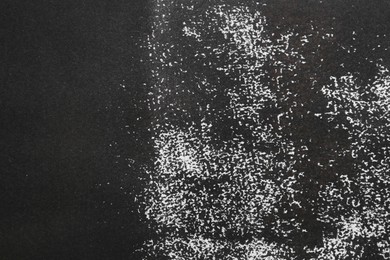 Photo of Texture of paper with black ink as background, top view