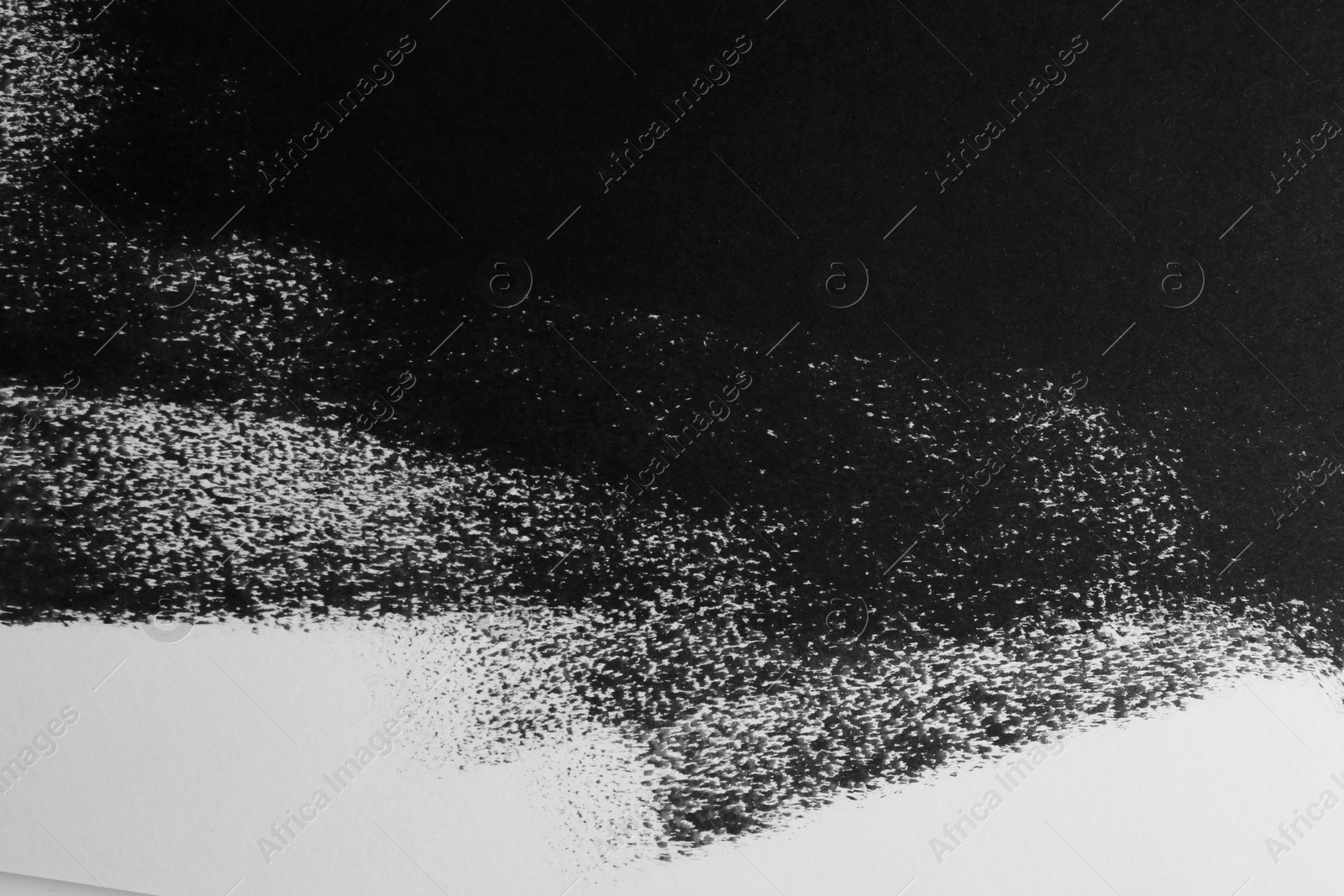 Photo of Texture of paper with black ink as background, top view