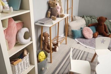 Stylish child room interior with modern furniture and toys