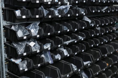 Many plastic boxes for storing car parts in auto store