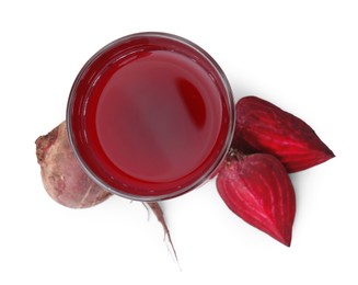 Photo of Fresh beet juice in glass and ripe vegetables isolated on white, top view