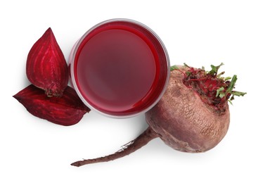 Fresh beet juice in glass and ripe vegetables isolated on white, top view