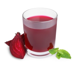 Photo of Fresh beet juice in glass, pieces of vegetable and mint isolated on white