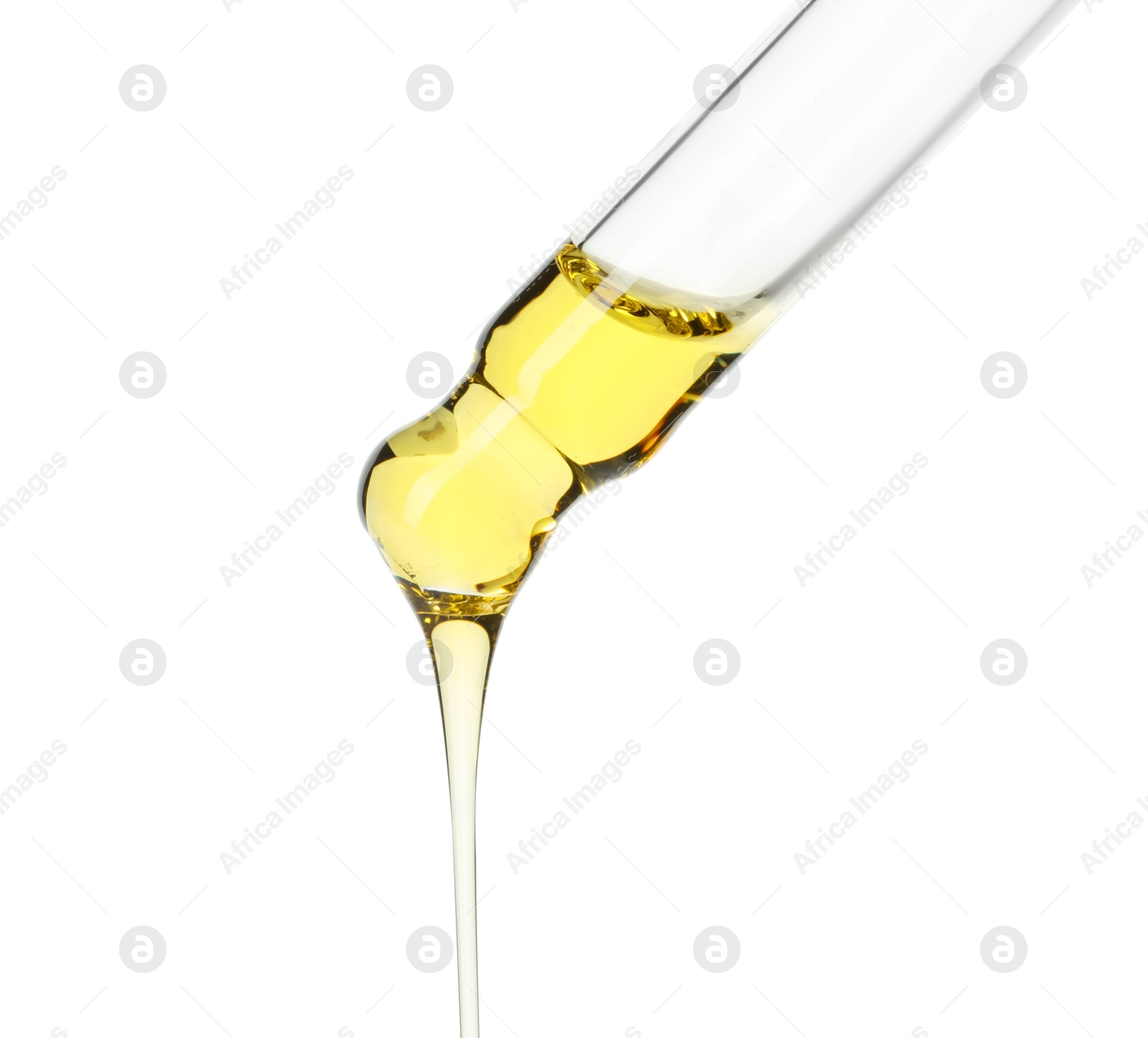 Photo of Dripping essential oil from pipette on white background