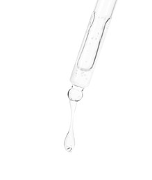 Photo of Dripping cosmetic serum from pipette on white background