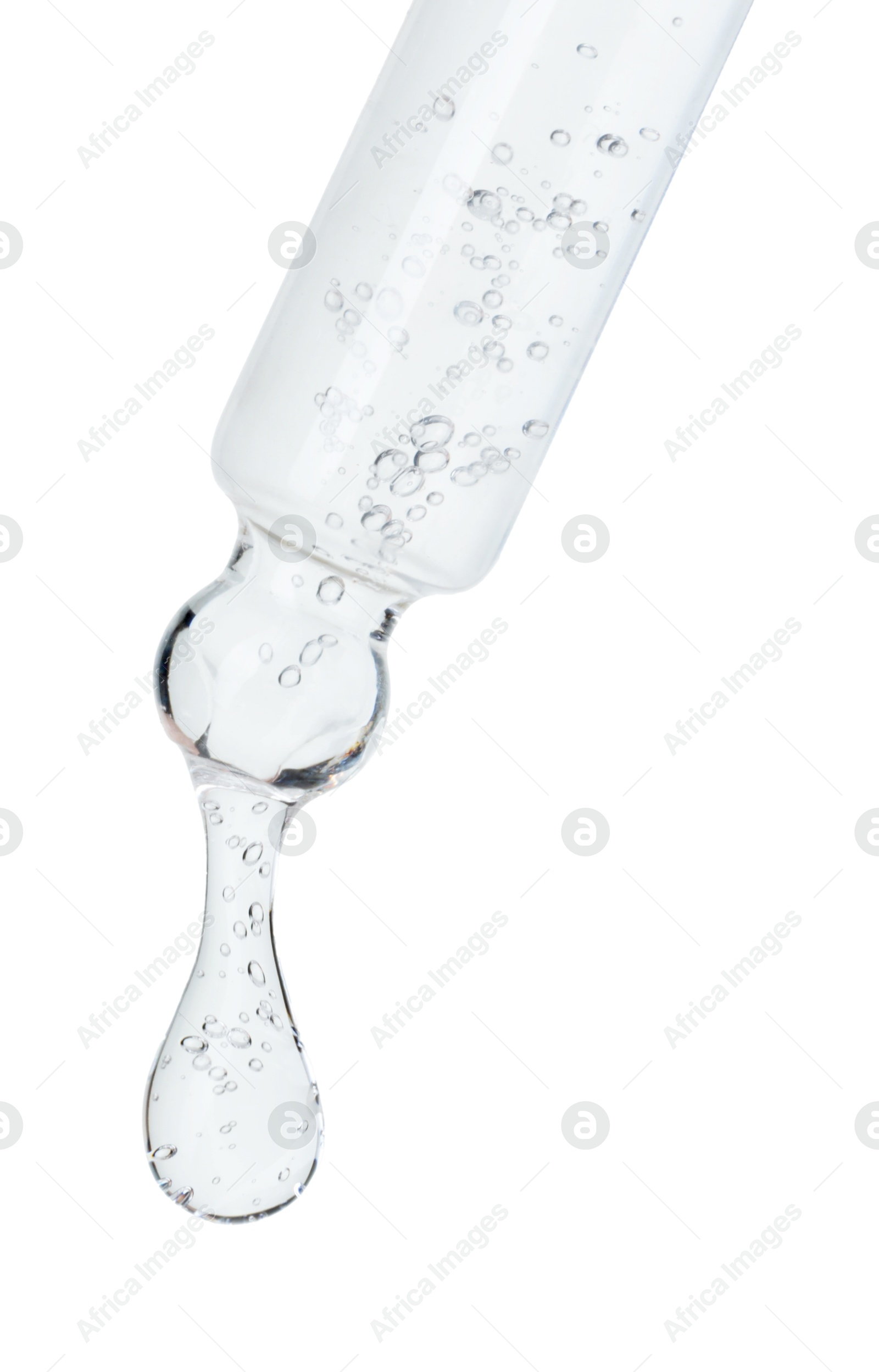 Photo of Dripping cosmetic serum from pipette on white background