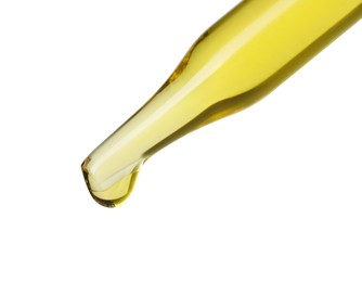 Photo of Dripping essential oil from pipette on white background