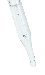 Photo of Dripping cosmetic serum from pipette on white background