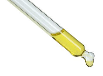 Photo of Dripping essential oil from pipette on white background