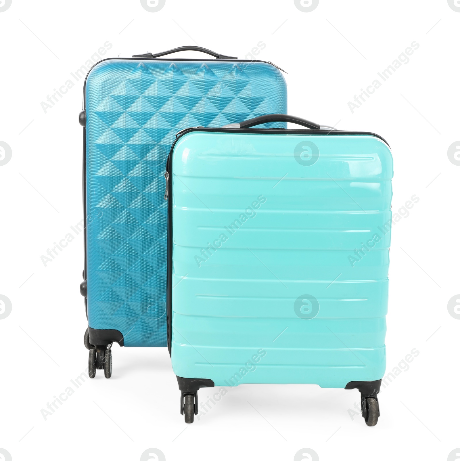 Photo of Two new light blue suitcases isolated on white