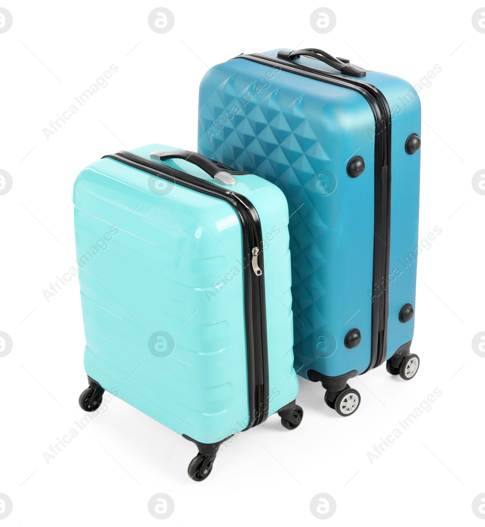 Photo of Two new light blue suitcases isolated on white