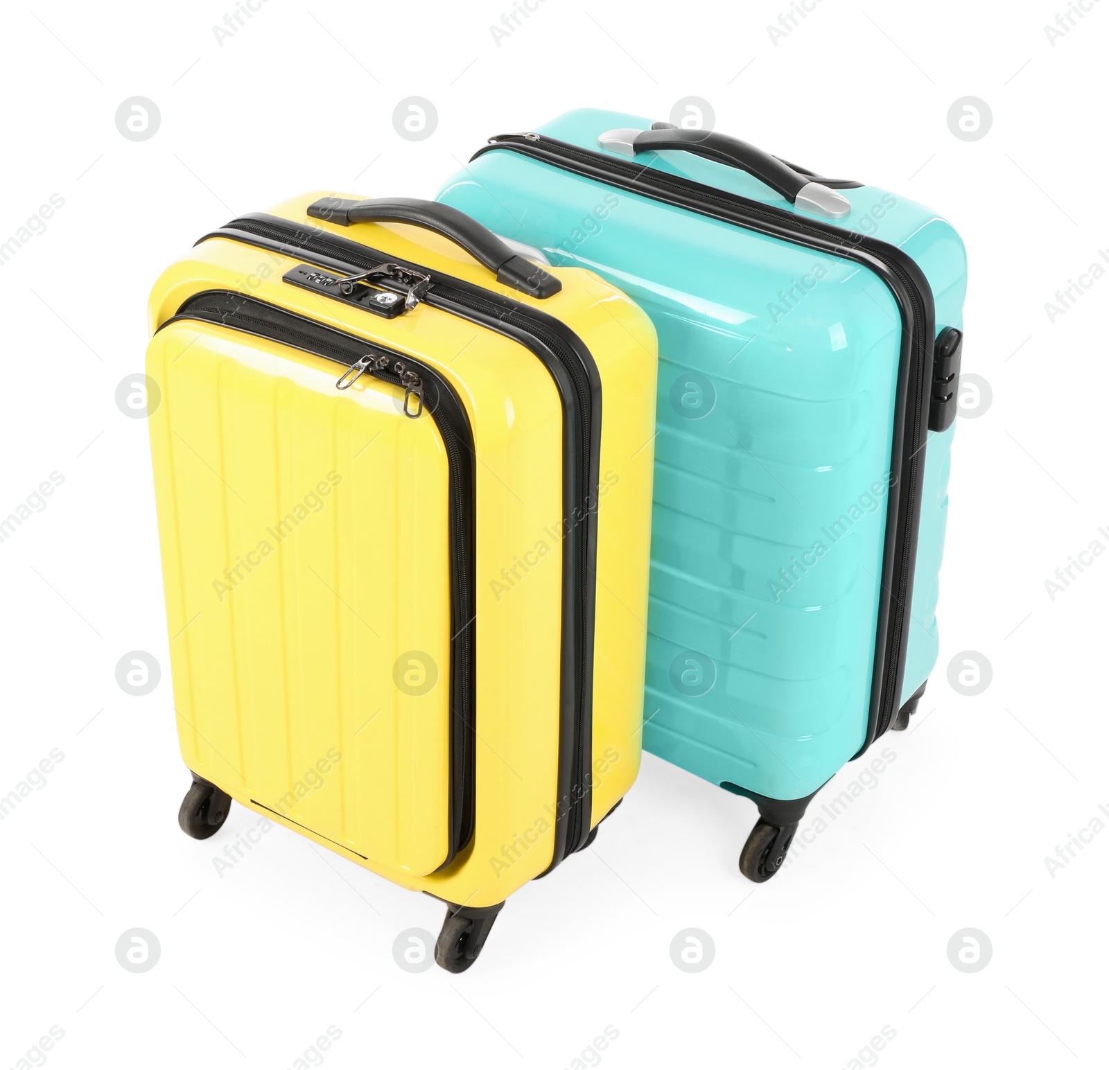 Photo of Two new yellow and light blue suitcases isolated on white