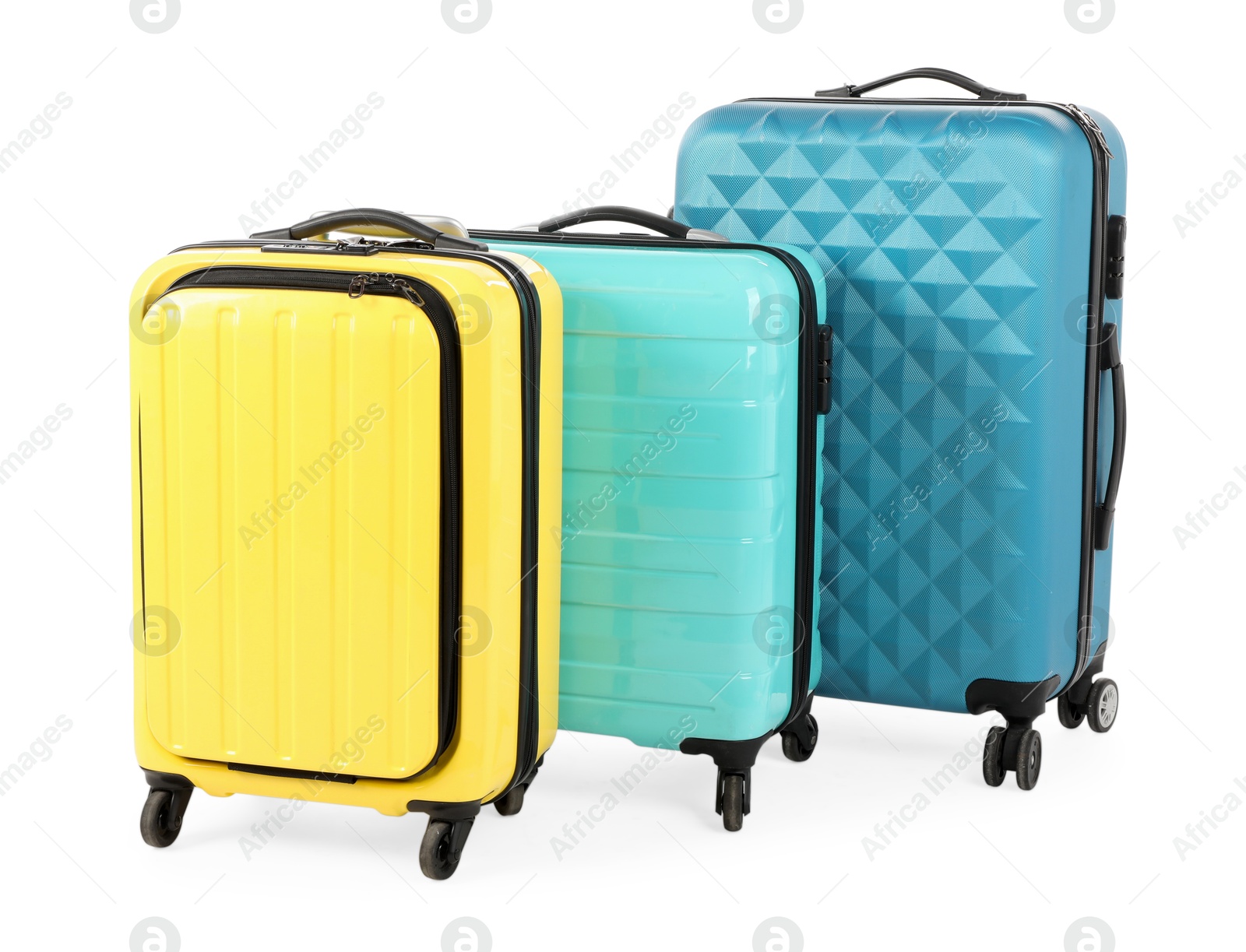 Photo of New yellow and light blue suitcases isolated on white