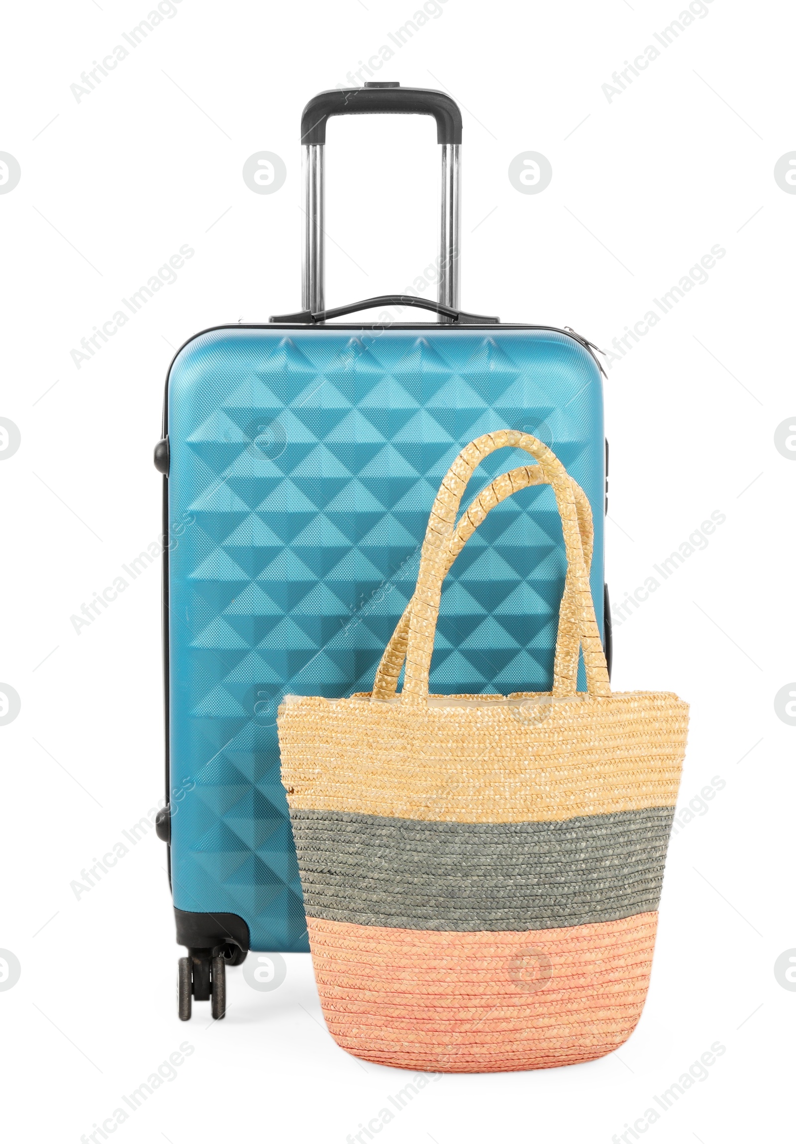 Photo of Light blue suitcase and bag isolated on white