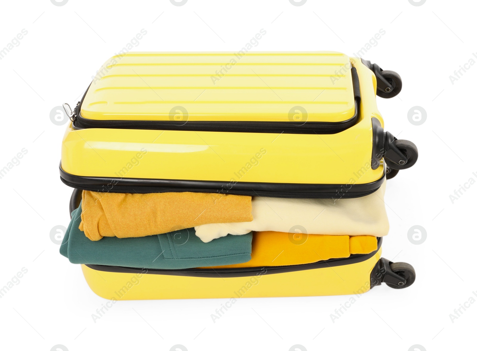 Photo of One new yellow suitcase with clothes isolated on white