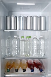 Photo of Many different cold drinks in refrigerator, closeup