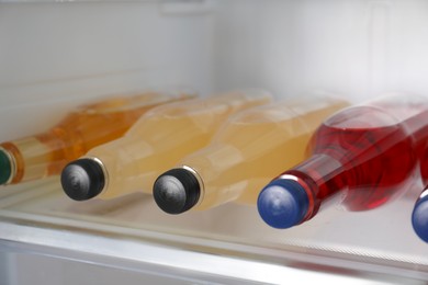 Many different cold drinks in refrigerator, closeup