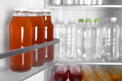 Many different cold drinks in refrigerator, closeup