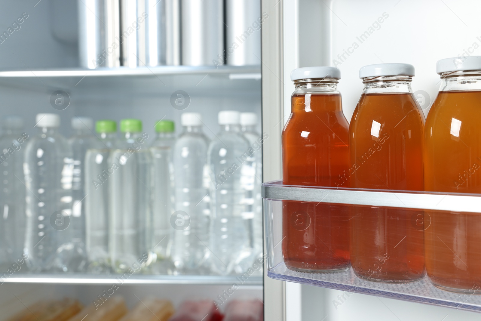 Photo of Many different cold drinks in refrigerator, closeup