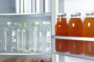 Photo of Many different cold drinks in refrigerator, closeup