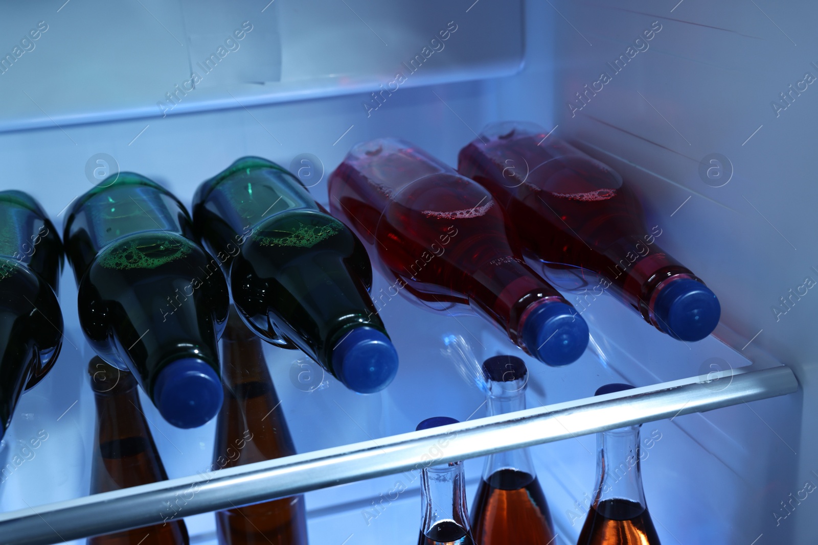 Photo of Many different cold drinks in refrigerator, closeup