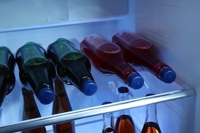 Many different cold drinks in refrigerator, closeup