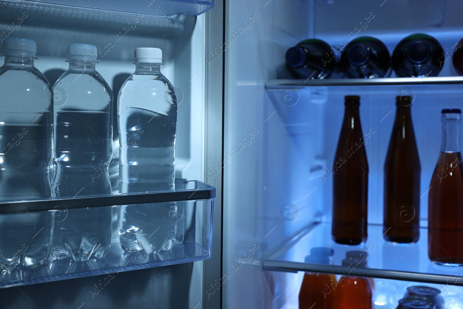 Photo of Many different cold drinks in refrigerator, closeup