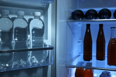 Photo of Many different cold drinks in refrigerator, closeup