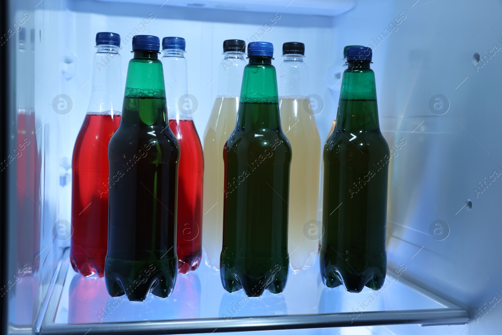 Photo of Many different cold drinks in refrigerator, closeup