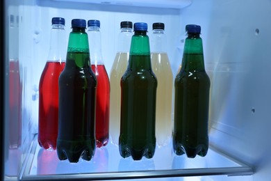 Many different cold drinks in refrigerator, closeup