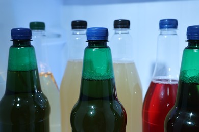 Many different cold drinks in refrigerator, closeup