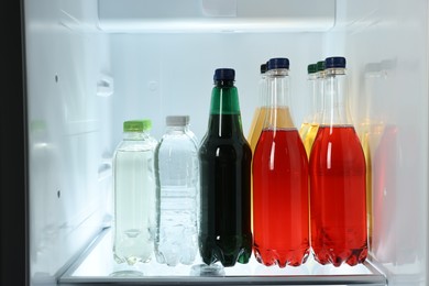 Many different cold drinks in refrigerator, closeup