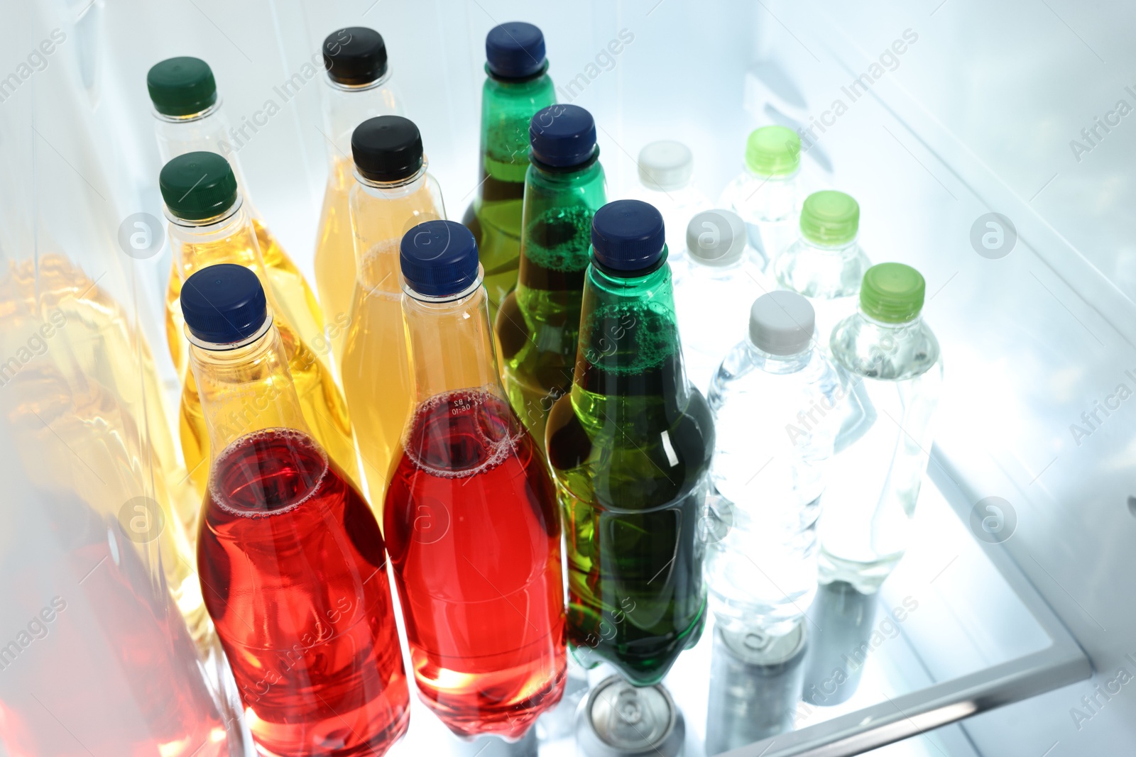 Photo of Many different cold drinks in refrigerator, closeup