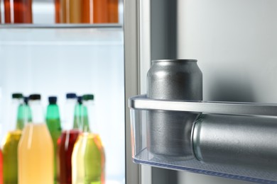 Many different cold drinks in refrigerator, closeup