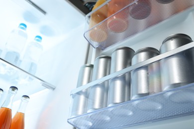 Many different cold drinks in refrigerator, low angle view