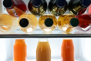 Photo of Many different cold drinks in refrigerator, closeup