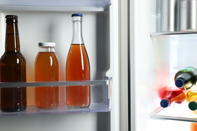 Many different cold drinks in refrigerator, closeup