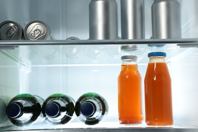 Photo of Many different cold drinks in refrigerator, closeup