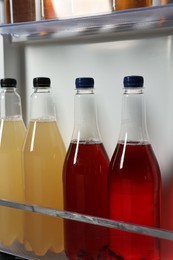 Many different cold drinks in refrigerator, closeup