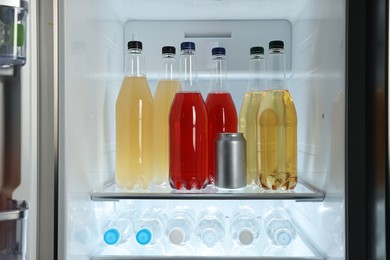 Many different cold drinks in refrigerator, closeup