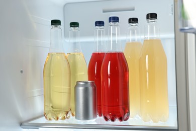 Many different cold drinks in refrigerator, closeup