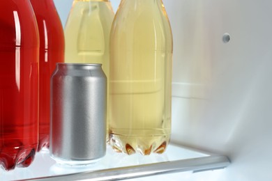 Many different cold drinks in refrigerator, closeup