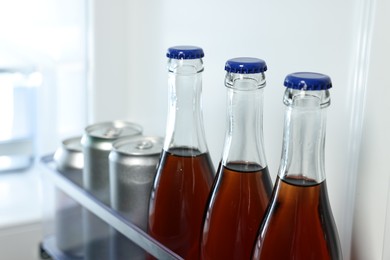 Many different cold drinks in refrigerator, closeup