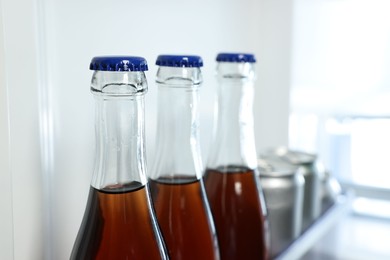 Many different cold drinks in refrigerator, closeup