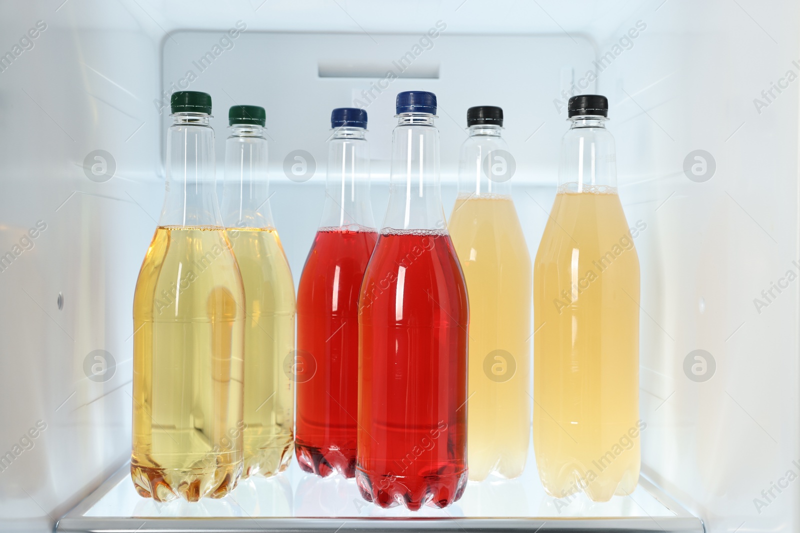 Photo of Many different cold drinks in refrigerator, closeup