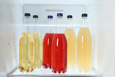 Photo of Many different cold drinks in refrigerator, closeup