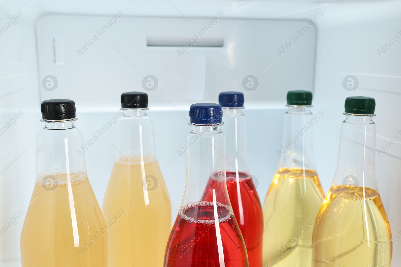 Photo of Many different cold drinks in refrigerator, closeup