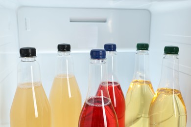 Many different cold drinks in refrigerator, closeup